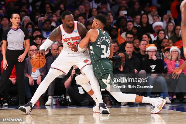 Giannis Antetokounmpo of the Milwaukee Bucks defends Julius Randle of the New York Knicks during the fourth quarter at Madison Square Garden on...