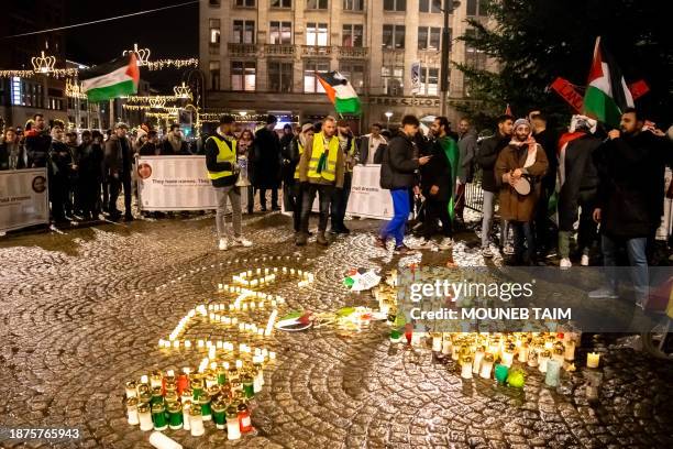 Amsterdam, Netherlands. A group of people were seen lighting candles to commemorate the people who died in Palestine, while also arranging the...