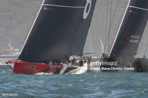 Andoo Comanche and SHK Scallywag head up Sydney Harbour during the 2023 Sydney to Hobart on Sydney Harbour, on December 26, 2023 in Sydney, Australia.