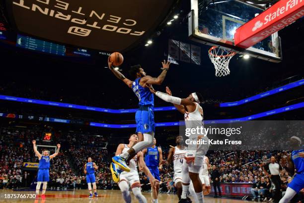 Luka Doncic of the Dallas Mavericks celebrates as Derrick Jones Jr. #55 dunks the ball during the game against the Phoenix Suns on December 25, 2023...