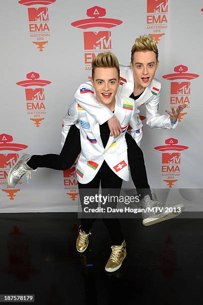 John and Edward Grimes of Jedward pose in the Exclusive Arrivals Studio during MTV EMA's 2013 at the Ziggo Dome on November 10, 2013 in Amsterdam,...