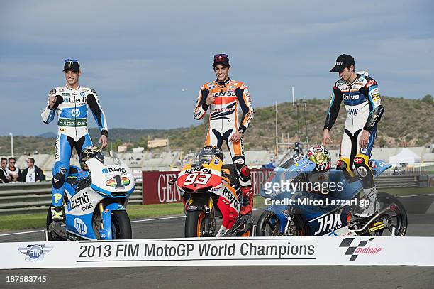 Pol Espargaro of Spain and Pons 40 HP Tuenti, Marc Marquez of Spain and Repsol Honda Team and Maverick Vinales of Spain and Team Calvo pose on track...