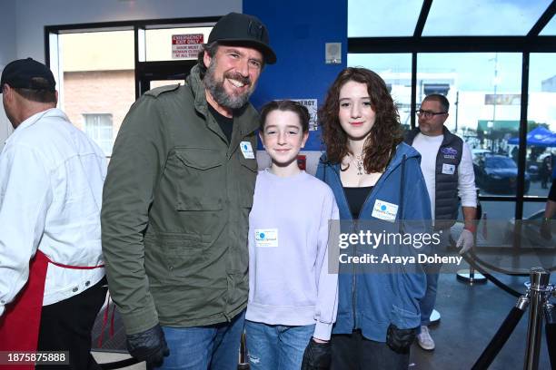 Alexis Denisof, Keeva Jane Denisof and Satyana Marie Denisof volunteer at the Los Angeles Mission's 87th Annual Christmas Celebration at Los Angeles...