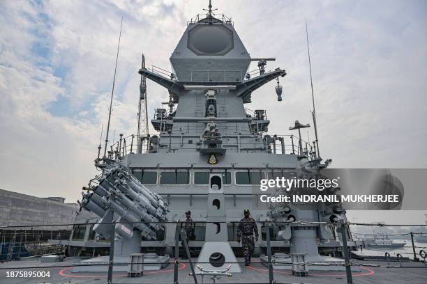 In this photograph taken on December 22 sailors stand next to Anti-Submarine Indigenous Rocket Launchers of the INS IMPHAL , the third stealth guided...