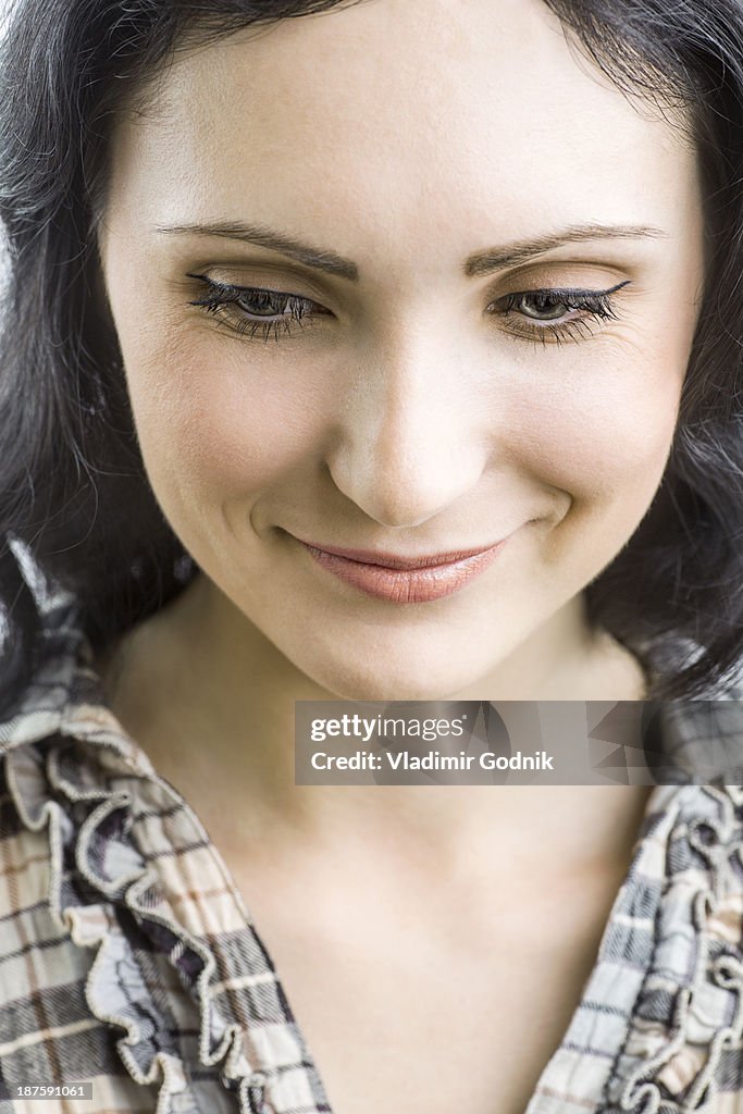 Portrait of beautiful woman looking down
