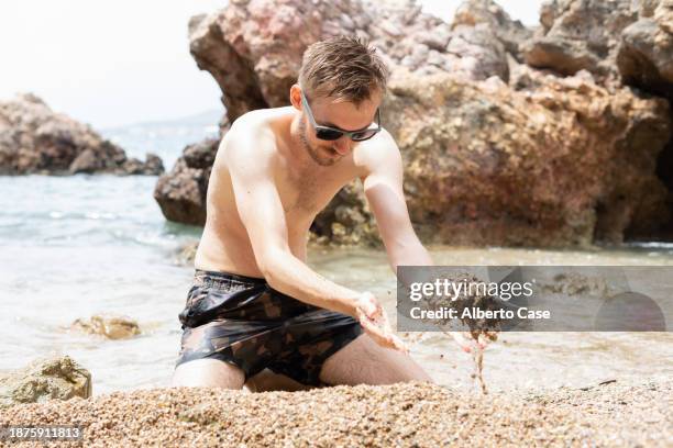 Man Digging Rocks 1,385 Man Throwing Rock Stock Photos, High-Res Pictures, and Images ...