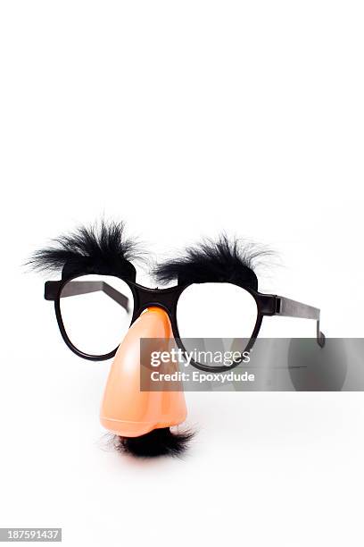 groucho marx novelty glasses on a white background - mask disguise stockfoto's en -beelden