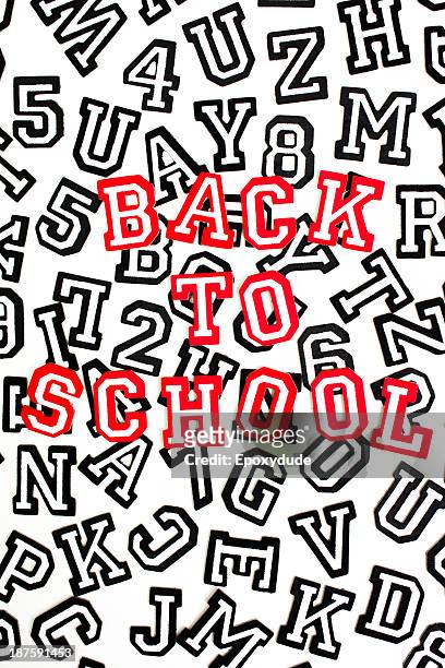 red outlined varsity font stickers spelling back to school on top of black outlined letters - varsity stock pictures, royalty-free photos & images