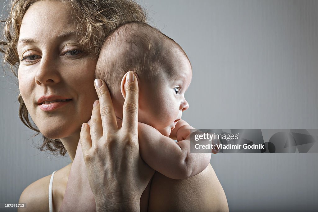 Mother holding her daughter