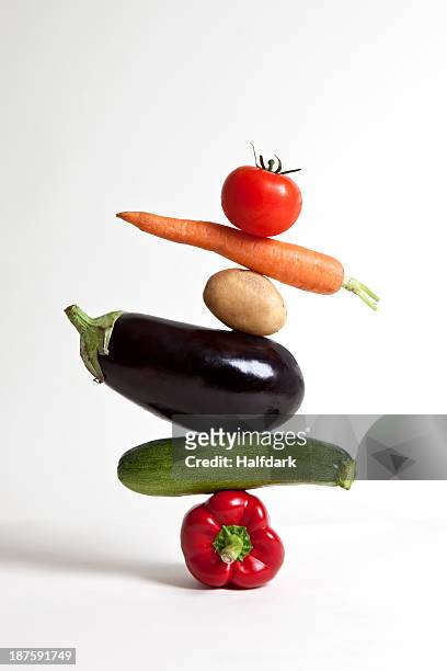 vegetables arranged in a stack - courgettes stock-fotos und bilder