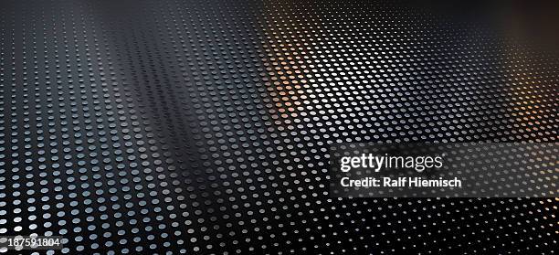 a pattern of metallic dots on a black background - sparkling stock illustrations