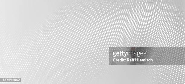 a wave pattern of white dots on a gray background - gray background stock illustrations