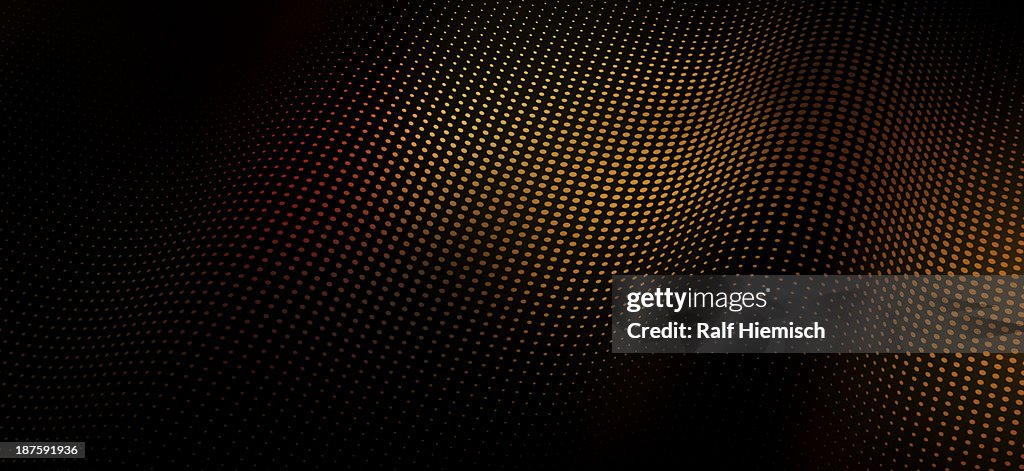 A wave pattern of dots over shadow
