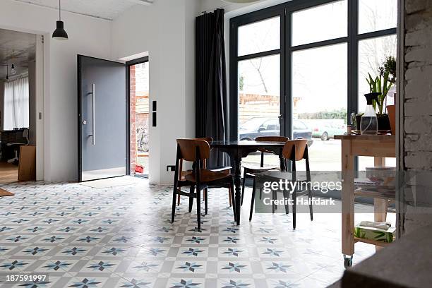 a hip tidy dining room with flooring that has a star shaped pattern - house entrance interior stock pictures, royalty-free photos & images