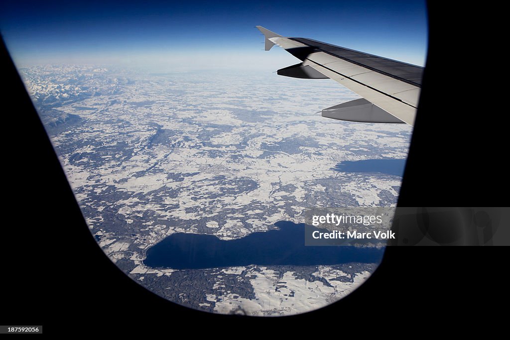 View of lakes within a snowy landscape from an airplane, Bavaria, Germany