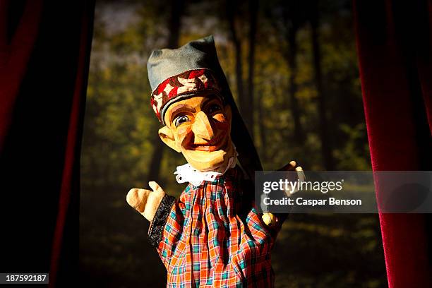 punch from the classic puppet show punch and judy standing on stage - puppet show stage stock pictures, royalty-free photos & images