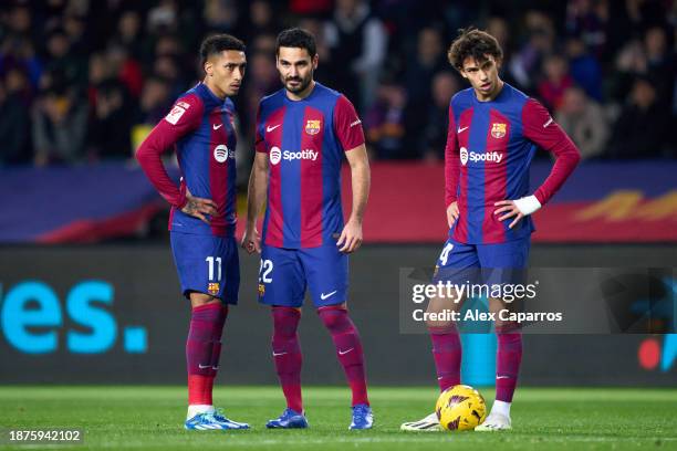 Raphinha, Ilkay Gundogan and Joao Felix of FC Barcelona prepare to take a free kick during the LaLiga EA Sports match between FC Barcelona and UD...