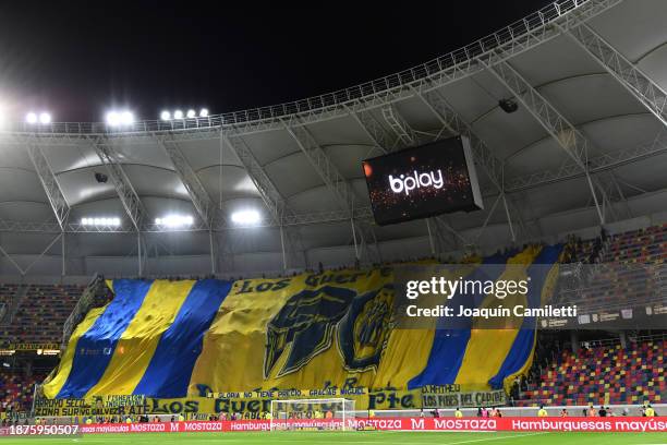 Fans of of Rosario Central display a large flag during the Trofeo de Campeones match between Rosario Central and River Plate at Estadio Unico Madre...
