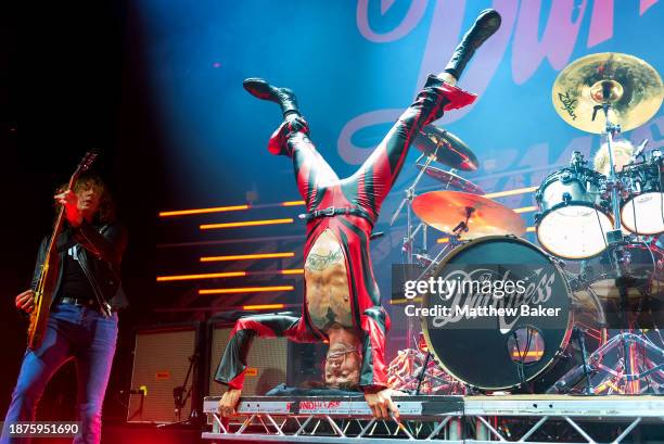 Dan Hawkins and Justin Hawkins of The Darkness perform at The Roundhouse on December 22, 2023 in London, England.