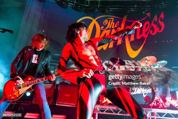 Dan Hawkins and Justin Hawkins of The Darkness perform at The Roundhouse on December 22, 2023 in London, England.