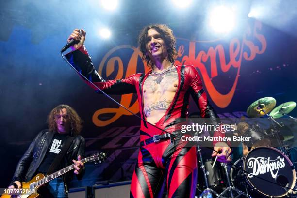 Dan Hawkins and Justin Hawkins of The Darkness perform at The Roundhouse on December 22, 2023 in London, England.