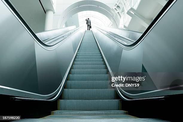 what next? - escalators stock pictures, royalty-free photos & images