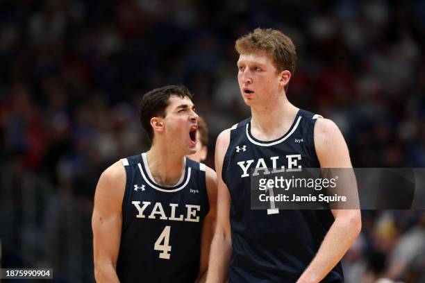 John Poulakidas and Danny Wolf of the Yale Bulldogs celebrate after a basket during the 1st half of the game against the Kansas Jayhawks at Allen...