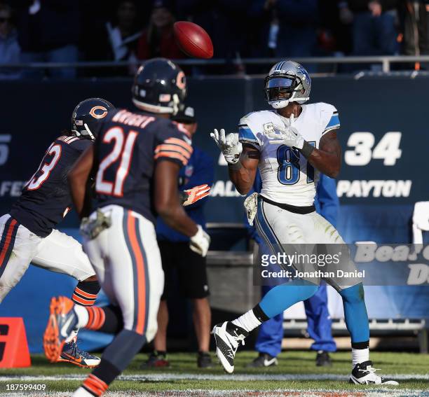 Calvin Johnson of the Detroit Lions makes the game-winning touchdown catch over Charles Tillman and Major Wright of the Chicago Bears at Soldier...