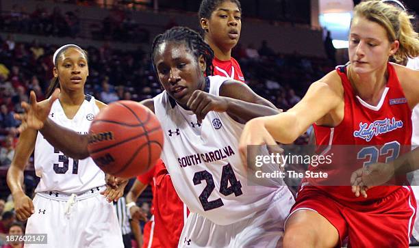 Alaina Welch of the South Carolina Gamecocks chases a loose ball with Savanna Langston of the Louisiana Tech Lady Techsters during the first half at...