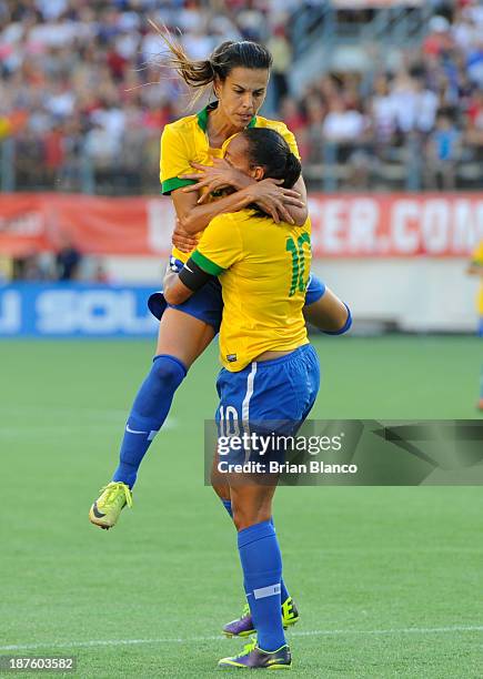 Midfielder Rosana of Brazil celebrates with defender Thaisa following Rosana's goal against the U.S. Women's National Team on November 10, 2013 at...