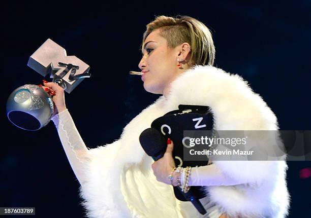 Miley Cyrus accepts award onstage during the MTV EMA's 2013 at the Ziggo Dome on November 10, 2013 in Amsterdam, Netherlands.