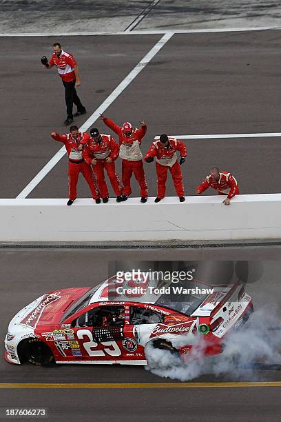Kevin Harvick, driver of the Budweiser Chevrolet, celebrates with a burnout after winning the NASCAR Sprint Cup Series AdvoCare 500 at Phoenix...