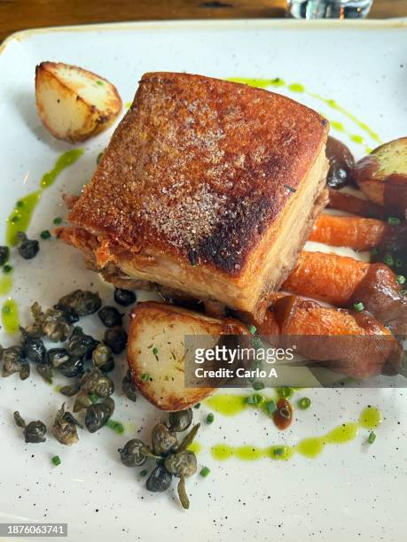 roast pork belly and vegetables - pork belly stock pictures, royalty-free photos & images