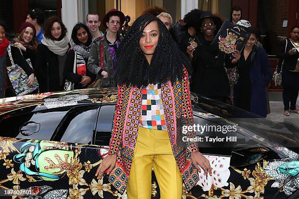 Singer Solange Knowles poses in front of a Lamborghini Murcielago decorated by Rashaad Newsome to celebrate the release of her "Saint Heron"...