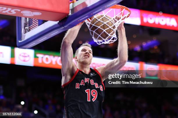 Jakob Poeltl of the Toronto Raptors dunks during the first quarter against the Philadelphia 76ers at the Wells Fargo Center on December 22, 2023 in...