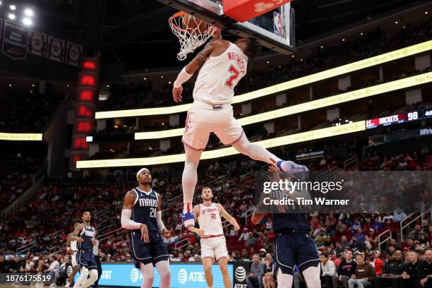 Cam Whitmore of the Houston Rockets dunks the ball in the second half in front of Dexter Dennis of the Dallas Mavericks and Richaun Holmes at Toyota...