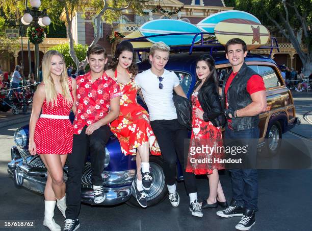 In this handout photo provided by Disney Parks, Mollee Gray, Garrett Clayton, Maia Mitchell, Ross Lynch, Grace Phipps and John DeLuca of the hit...