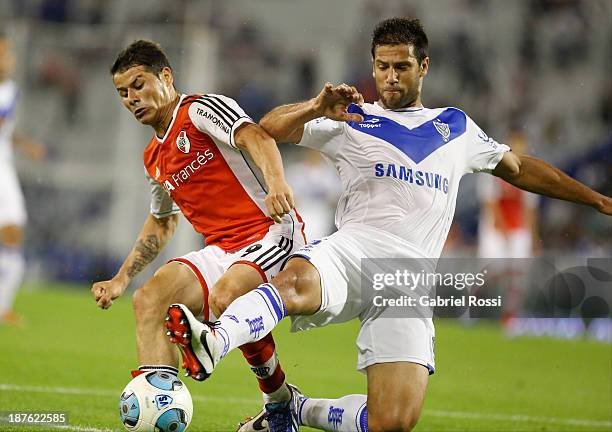 Rodrigo Mora of River Plate fights for the ball with Sebastian Dominguez of Velez Sarsfield during a match between Velez Sarsfield and River Plate as...