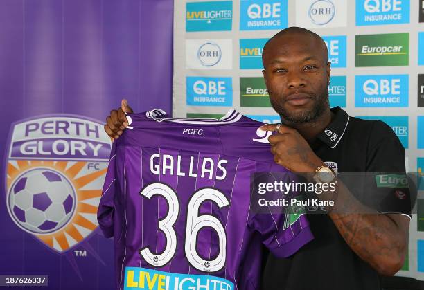 New Perth Glory A-League recruit William Gallas poses with his playing top at a press conference at Cape Lamberts Gold offices on November 11, 2013...