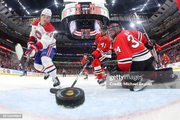 Juraj Slafkovsky of the Montreal Canadiens scores a goal past Petr Mrazek of the Chicago Blackhawks during the second period at the United Center on...