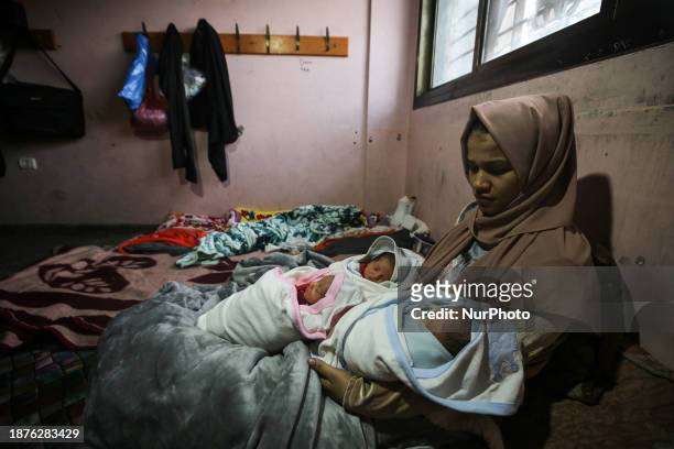 Iman Al-Masri, a displaced Palestinian, is giving birth to quadruplets in the shelter center at the Rufaydah School in Deir Balah in the central Gaza...