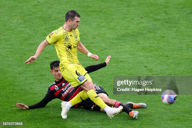 Tim Payne of the Phoenix is tackled by w14during the A-League Men round nine match between Wellington Phoenix and Western Sydney Wanderers at Sky...