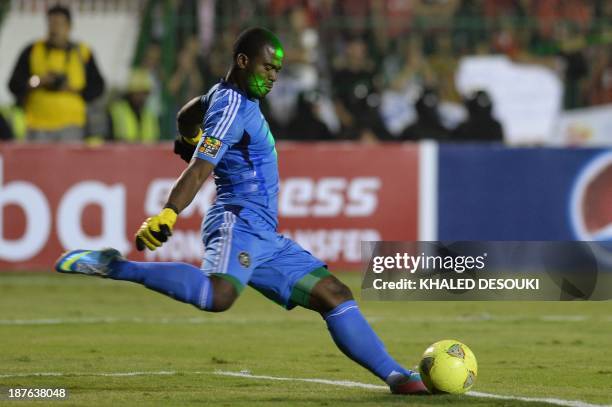 Al-Ahly's Egyptian fans direct a laser beam into Orlando Pirates' South African goalkeeper Senzo Meyiwa's face during the CAF Champions League...