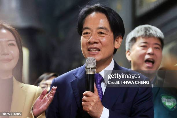 Taiwan's ruling Democratic Progressive Party presidential candidate Lai Ching-te speaks while campaigning at a local temple in Taipei on December 26,...