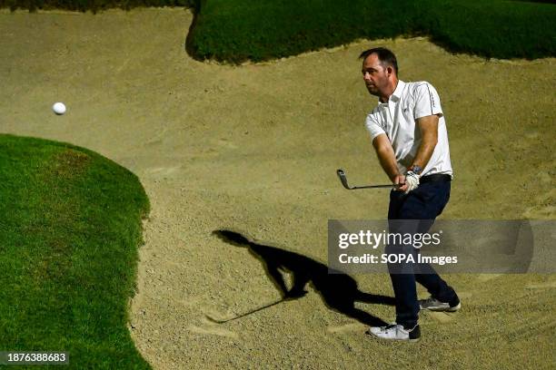 An amateur golfer hits a golf shot. The Yas Acres and Country Club, Night Golf, Abu Dhabi, UAE. The 9-hole Fry / Straka designed, 3700-yard, , golf...