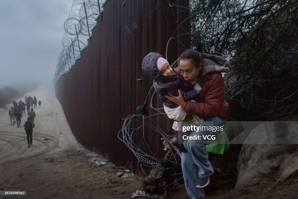 Migrants At The US-Mexico Border