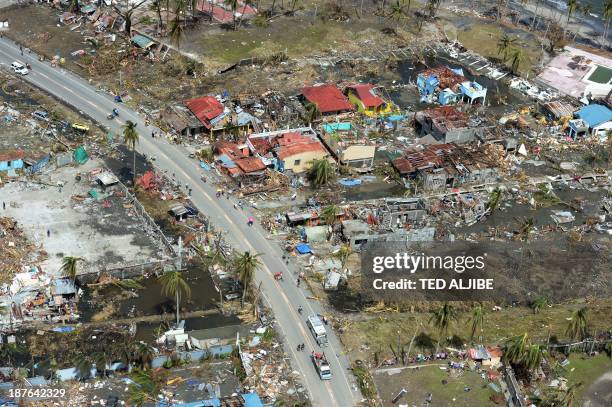 This aerial photo shows destroyed houses in the city of Tacloban, Leyte province, in the central Philippines on November 11 only days after Super...