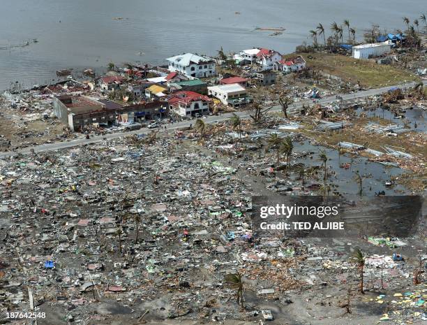 This aerial photo shows destroyed houses in the city of Tacloban, Leyte province, in the central Philippines on November 11 only days after Super...