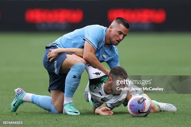 Robert Mak of Sydney FC and Benjamin Garuccio of United compete for the ball during the A-League Men round nine match between Sydney FC and Western...