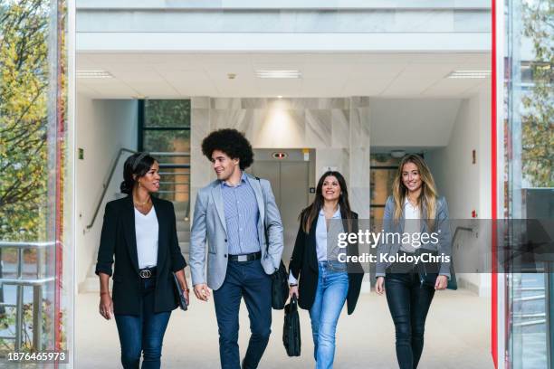 multiethnic young business professionals enjoying a walk together - administrative professionals day stock-fotos und bilder